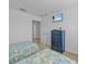 Spacious bedroom with two twin beds and a dresser, plus access to another room at 204 Paloma Dr, Davenport, FL 33837