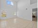Spacious living room with high ceilings and tile floors at 204 Paloma Dr, Davenport, FL 33837