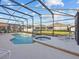 Spacious screened pool and spa area with ample lounging space at 204 Paloma Dr, Davenport, FL 33837