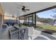 Screened patio with dining area and backyard access at 20811 Sullivan Ranch Blvd, Mount Dora, FL 32757