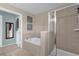 Relaxing bathroom with soaking tub and walk-in shower at 20811 Sullivan Ranch Blvd, Mount Dora, FL 32757