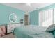 Bedroom with a bed, dresser, and calming decor at 20811 Sullivan Ranch Blvd, Mount Dora, FL 32757