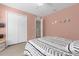 Bedroom with a double bed, closet, and calming decor at 20811 Sullivan Ranch Blvd, Mount Dora, FL 32757