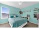 Teal bedroom with a bed, shelving, and plenty of space at 20811 Sullivan Ranch Blvd, Mount Dora, FL 32757