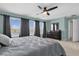 Bright bedroom featuring large windows and ceiling fan at 20811 Sullivan Ranch Blvd, Mount Dora, FL 32757