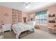 Charming bedroom with a bed, dresser, and tasteful decor at 20811 Sullivan Ranch Blvd, Mount Dora, FL 32757