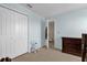 Bedroom with a closet and dresser, and access to a bathroom at 20811 Sullivan Ranch Blvd, Mount Dora, FL 32757