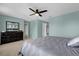 Spacious bedroom with ceiling fan and large dresser at 20811 Sullivan Ranch Blvd, Mount Dora, FL 32757