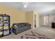 Spacious bonus room with a couch and access to the laundry and another bedroom at 20811 Sullivan Ranch Blvd, Mount Dora, FL 32757