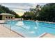 Inviting community pool with lounge chairs and a shaded seating area at 20811 Sullivan Ranch Blvd, Mount Dora, FL 32757