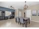 Dining area with a table and chairs, built-in bench seating, and access to kitchen at 20811 Sullivan Ranch Blvd, Mount Dora, FL 32757