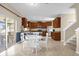 Kitchen with wooden cabinetry, granite countertops, and stainless steel appliances at 20811 Sullivan Ranch Blvd, Mount Dora, FL 32757