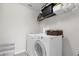 Laundry room with washer, dryer, and shelving at 20811 Sullivan Ranch Blvd, Mount Dora, FL 32757