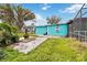 Cozy backyard area featuring a fire pit on a stone patio, perfect for outdoor relaxation at 211 Indiana Ave, St Cloud, FL 34769