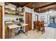 This kitchen is bright and spacious with a wooden ceiling, tile floors, and custom wooden shelving at 211 Indiana Ave, St Cloud, FL 34769