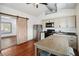 A contemporary kitchen with a stainless steel refrigerator and barn door access at 211 Indiana Ave, St Cloud, FL 34769