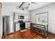 Functional kitchen with stainless steel appliances and a cozy dining area at 211 Indiana Ave, St Cloud, FL 34769