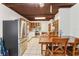 Charming kitchen with stainless steel appliances, wooden ceiling, and tile flooring at 211 Indiana Ave, St Cloud, FL 34769