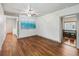 Cozy living room featuring hardwood floors and freshly painted walls at 211 Indiana Ave, St Cloud, FL 34769