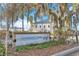 Welcoming Lakefront Boulevard sign surrounded by lush greenery and palm trees on a sunny day at 211 Indiana Ave, St Cloud, FL 34769