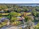 Wide aerial view of the house and surrounding neighborhood at 223 Royal Oaks Cir, Longwood, FL 32779
