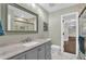 Elegant bathroom with a modern vanity and a large mirror at 223 Royal Oaks Cir, Longwood, FL 32779