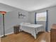 Bright bedroom with wood floors and window coverings at 223 Royal Oaks Cir, Longwood, FL 32779