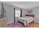 Bedroom with wood floors, window treatments, and rug at 223 Royal Oaks Cir, Longwood, FL 32779