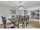 Elegant dining room with a chandelier and adjacent kitchen view at 223 Royal Oaks Cir, Longwood, FL 32779