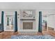 Living room fireplace with a modern design and teal accents at 223 Royal Oaks Cir, Longwood, FL 32779