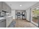 Modern kitchen with gray cabinets, stainless steel appliances, and tile flooring at 223 Royal Oaks Cir, Longwood, FL 32779