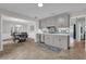 Updated kitchen featuring gray cabinets, quartz countertops, and a tile backsplash at 223 Royal Oaks Cir, Longwood, FL 32779