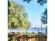 Scenic lake view from the neighborhood park showcasing lush greenery and a tranquil waterfront at 223 Royal Oaks Cir, Longwood, FL 32779