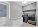 Convenient laundry room with washer, dryer, and extra storage at 223 Royal Oaks Cir, Longwood, FL 32779