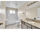 Bathroom with granite vanity, tub, and shower at 2321 Prime Cir # B, Kissimmee, FL 34746