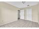 Bright bedroom with tile flooring and double door closet at 2321 Prime Cir # B, Kissimmee, FL 34746