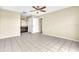 Bright bedroom with ensuite bathroom and tile floors at 2321 Prime Cir # B, Kissimmee, FL 34746