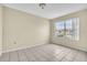 Well-lit bedroom with large window and tile floors at 2321 Prime Cir # B, Kissimmee, FL 34746