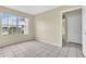 Bedroom with large window, closet, and tile floors at 2321 Prime Cir # B, Kissimmee, FL 34746