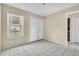 Bedroom with double door closet and window view at 2321 Prime Cir # B, Kissimmee, FL 34746