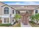 Two-story condo building with stairs and balconies at 2321 Prime Cir # B, Kissimmee, FL 34746