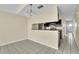 Kitchen with granite counters, dark cabinets, and breakfast bar at 2321 Prime Cir # B, Kissimmee, FL 34746