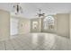 Spacious living room featuring tile floors and a large window at 2321 Prime Cir # B, Kissimmee, FL 34746