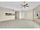 Open living area with kitchen bar and tile flooring at 2321 Prime Cir # B, Kissimmee, FL 34746