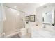 A clean bathroom with a shower, toilet, and white vanity at 2641 Tranquility Way, Kissimmee, FL 34746