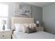 Bedroom with a queen bed, stylish pillows and modern decor at 2641 Tranquility Way, Kissimmee, FL 34746