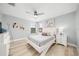 Bright bedroom with comfortable queen bed and light wood floors at 2641 Tranquility Way, Kissimmee, FL 34746