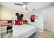 Mickey Mouse themed bedroom with red and black accents at 2641 Tranquility Way, Kissimmee, FL 34746