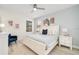 Main bedroom with a king-size bed, blue accents, and light walls at 2641 Tranquility Way, Kissimmee, FL 34746