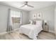 Bedroom with a queen bed, light gray walls, and gray accents at 2641 Tranquility Way, Kissimmee, FL 34746